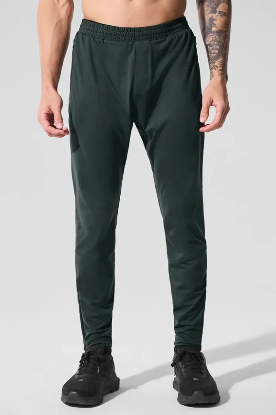 Pantalón deportivo Conquer React — Verde carbón