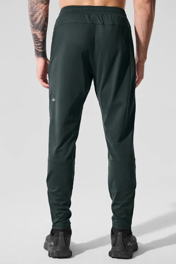 Pantalón deportivo Conquer React — Verde carbón