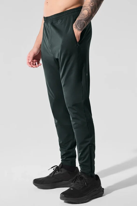 Pantalón deportivo Conquer React — Verde carbón