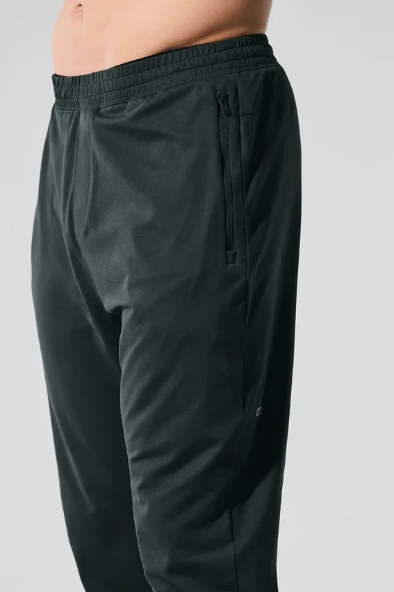 Pantalón deportivo Conquer React — Verde carbón