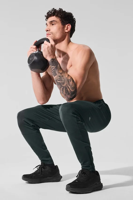 Pantalón deportivo Conquer React — Verde carbón